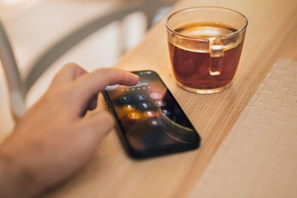Hand unlocking a smartphone screen representing privacy management