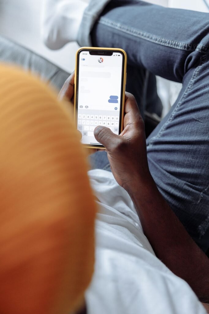 Person texting on a cell phone, representing disappearing chat messages